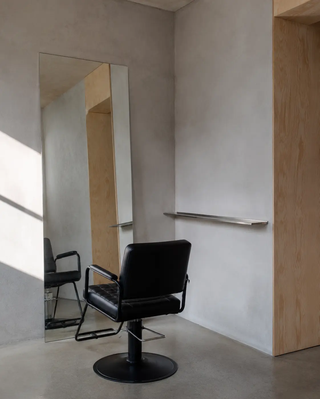 A minimal KOOP chair rental styling station within ROOH